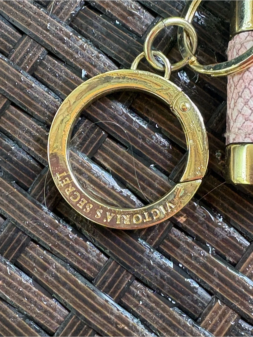 Victoria's Secret padlock keychain features a rose gold finish and a pink snakes